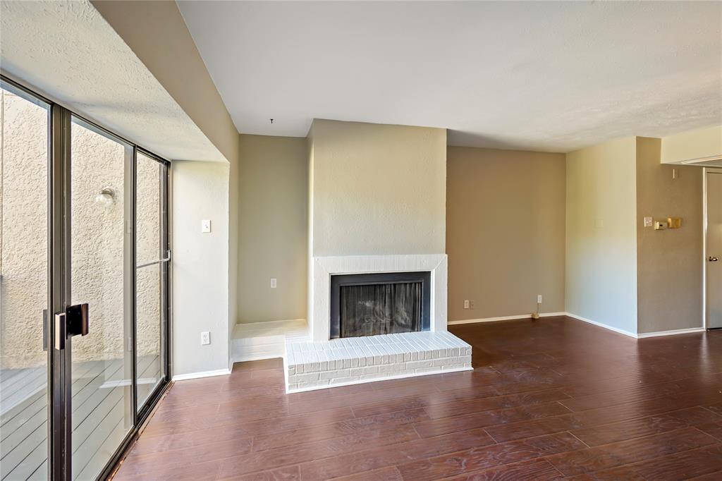 4523 North O'Connor Road, Unit 1177 Irving, TX 75062 - Photo 14 of 31 a view of an empty room with wooden floor and a window