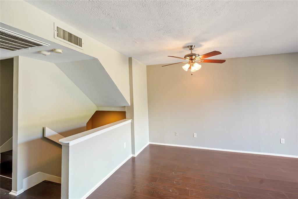 4523 North O'Connor Road, Unit 1177 Irving, TX 75062 - Photo 16 of 31 a view of an empty room with a ceiling fan