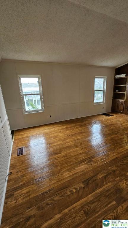 222 Independence Way Mount Bethel, PA 18343 - Photo 21 of 33 an empty room with wooden floor and windows
