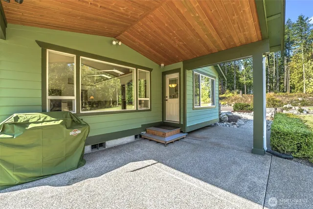 a backyard of a house with outdoor seating
