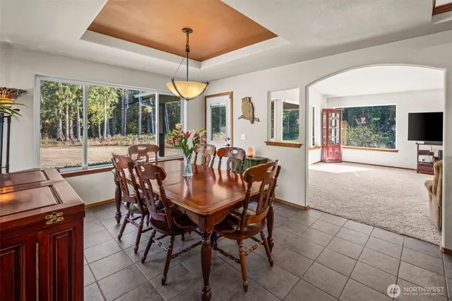 a view of a dining room with furniture wooden floor and chandelier