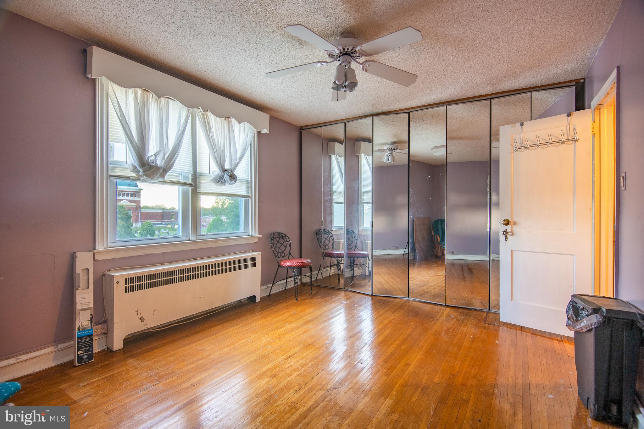 7617 Woolston Avenue Philadelphia, PA 19150 - Photo 19 of 24 a view of room with window and wooden floor