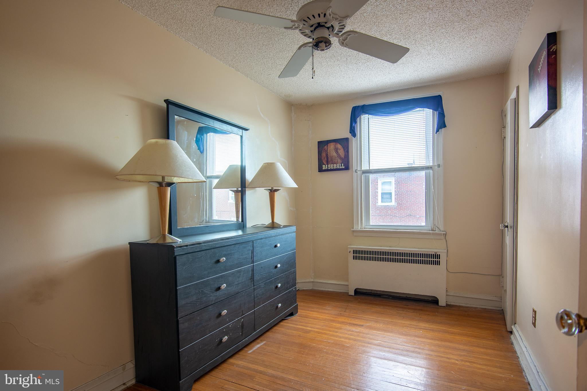 7617 Woolston Avenue Philadelphia, PA 19150 - Photo 22 of 24 a view of room with window and hardwood floor