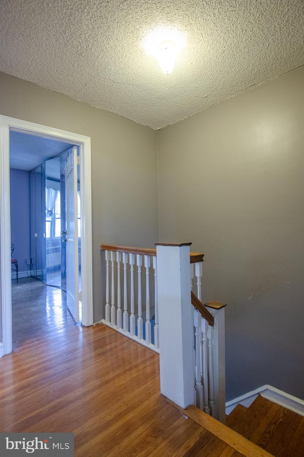 7617 Woolston Avenue Philadelphia, PA 19150 - Photo 24 of 24 a view of a bedroom with wooden floor