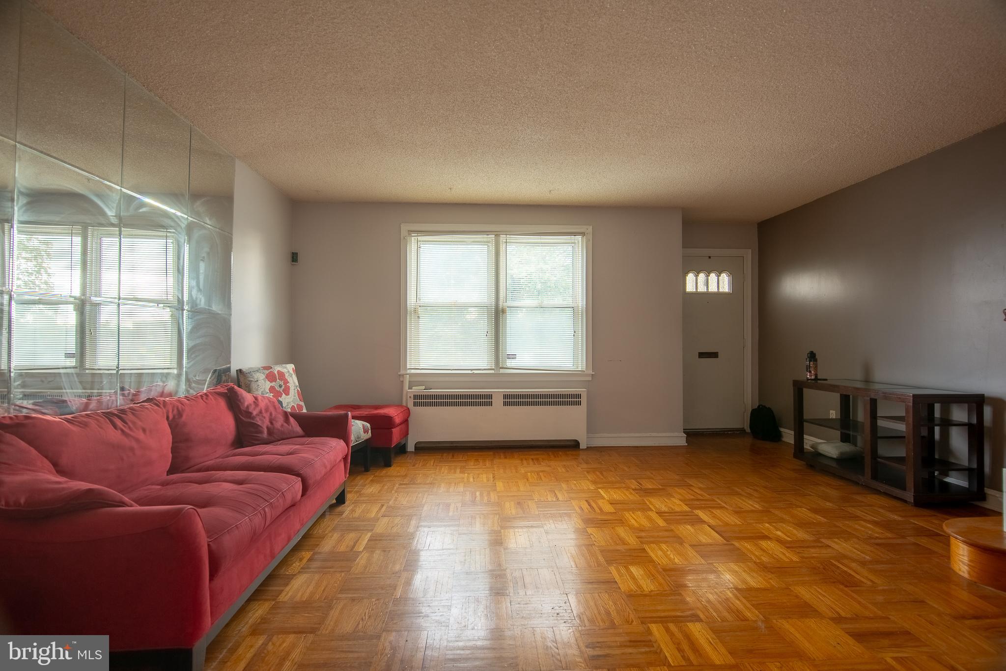7617 Woolston Avenue Philadelphia, PA 19150 - Photo 3 of 24 a living room with furniture and a window
