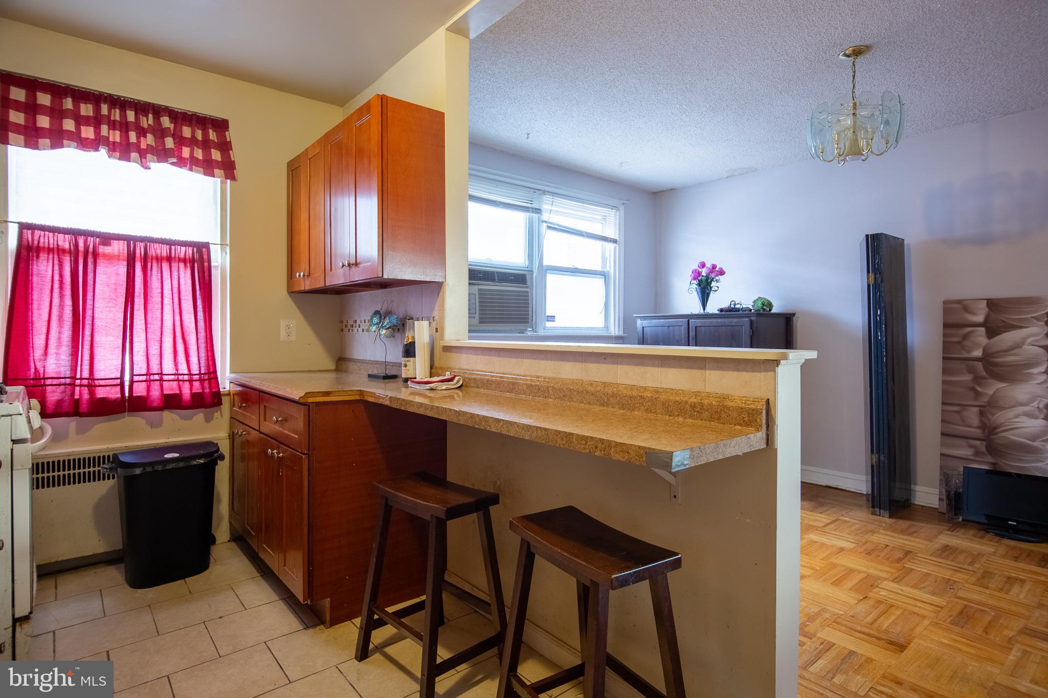 7617 Woolston Avenue Philadelphia, PA 19150 - Photo 6 of 24 a kitchen with a sink stove and refrigerator