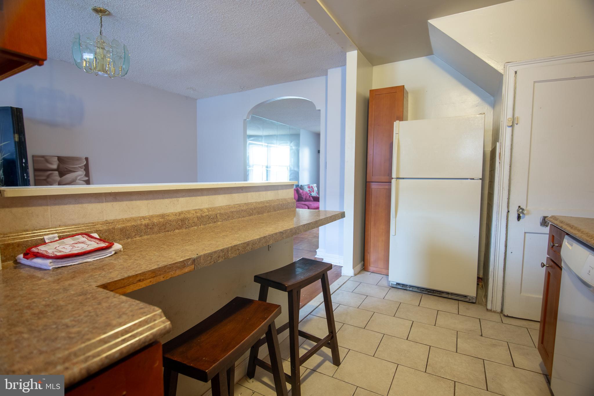 7617 Woolston Avenue Philadelphia, PA 19150 - Photo 7 of 24 a room with a table and chairs