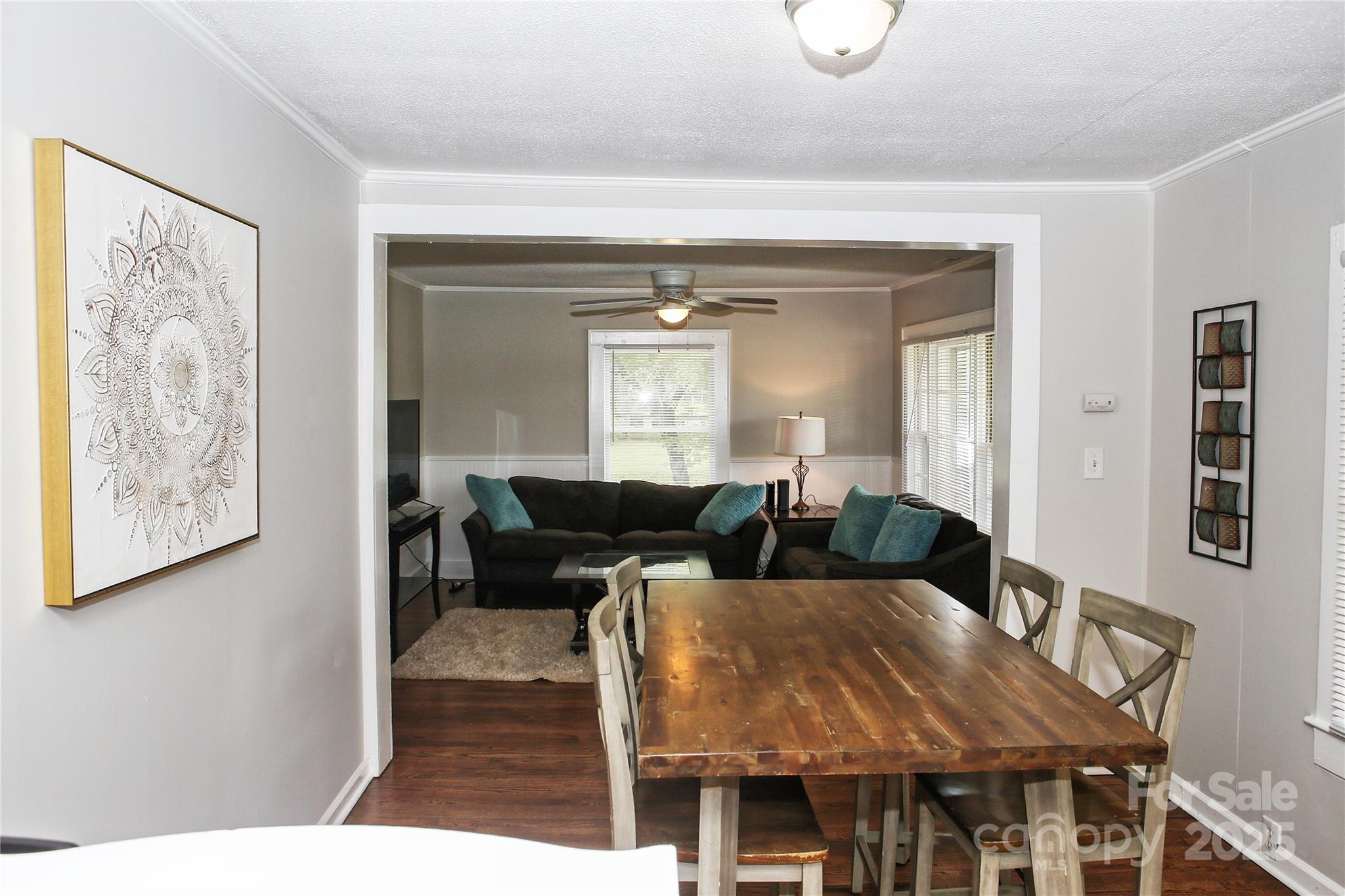 218 Blacksnake Road Stanley, NC 28164 - Photo 14 of 36 a view of a dining room with furniture and wooden floor