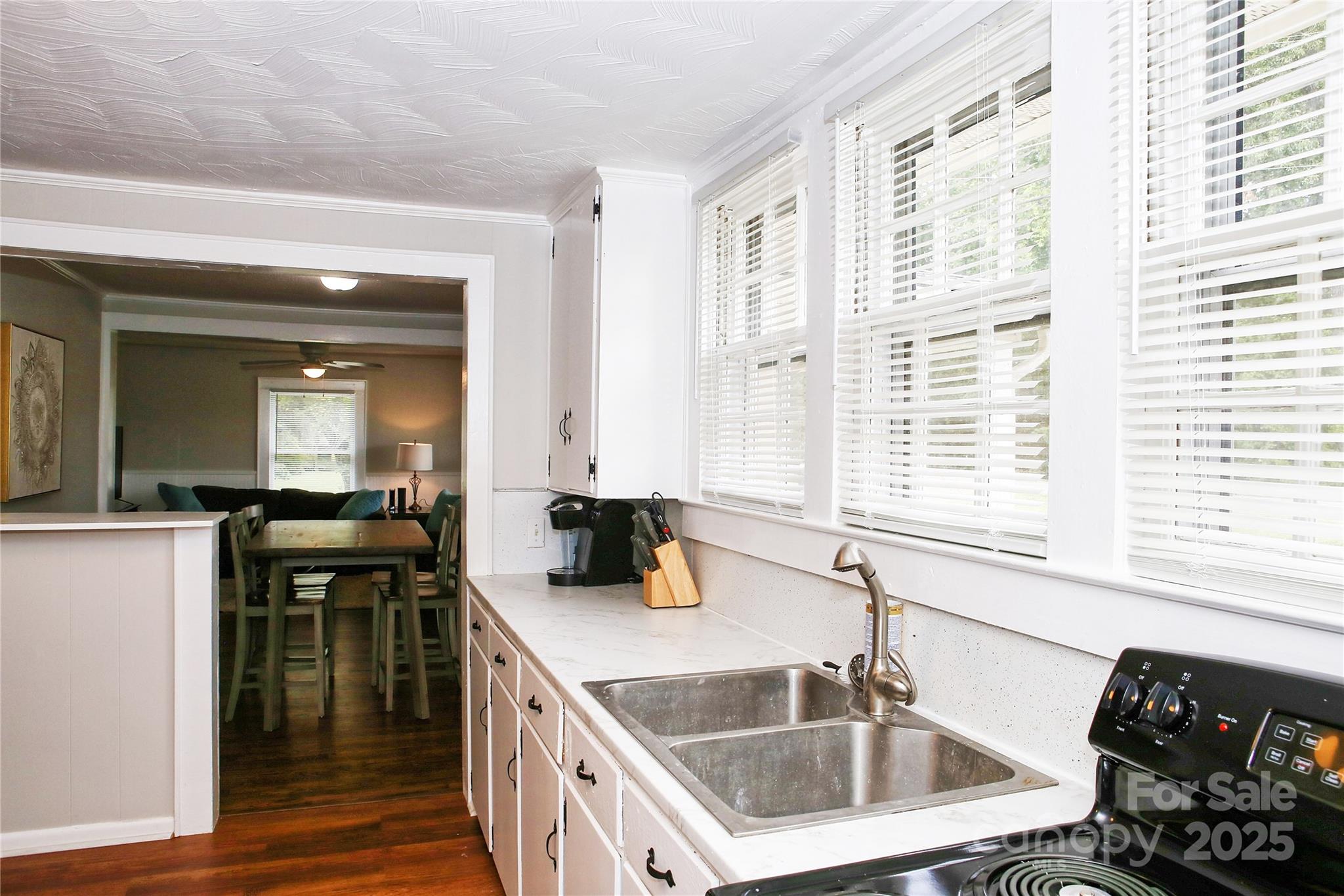 218 Blacksnake Road Stanley, NC 28164 - Photo 17 of 36 a kitchen that has a sink and a stove in it