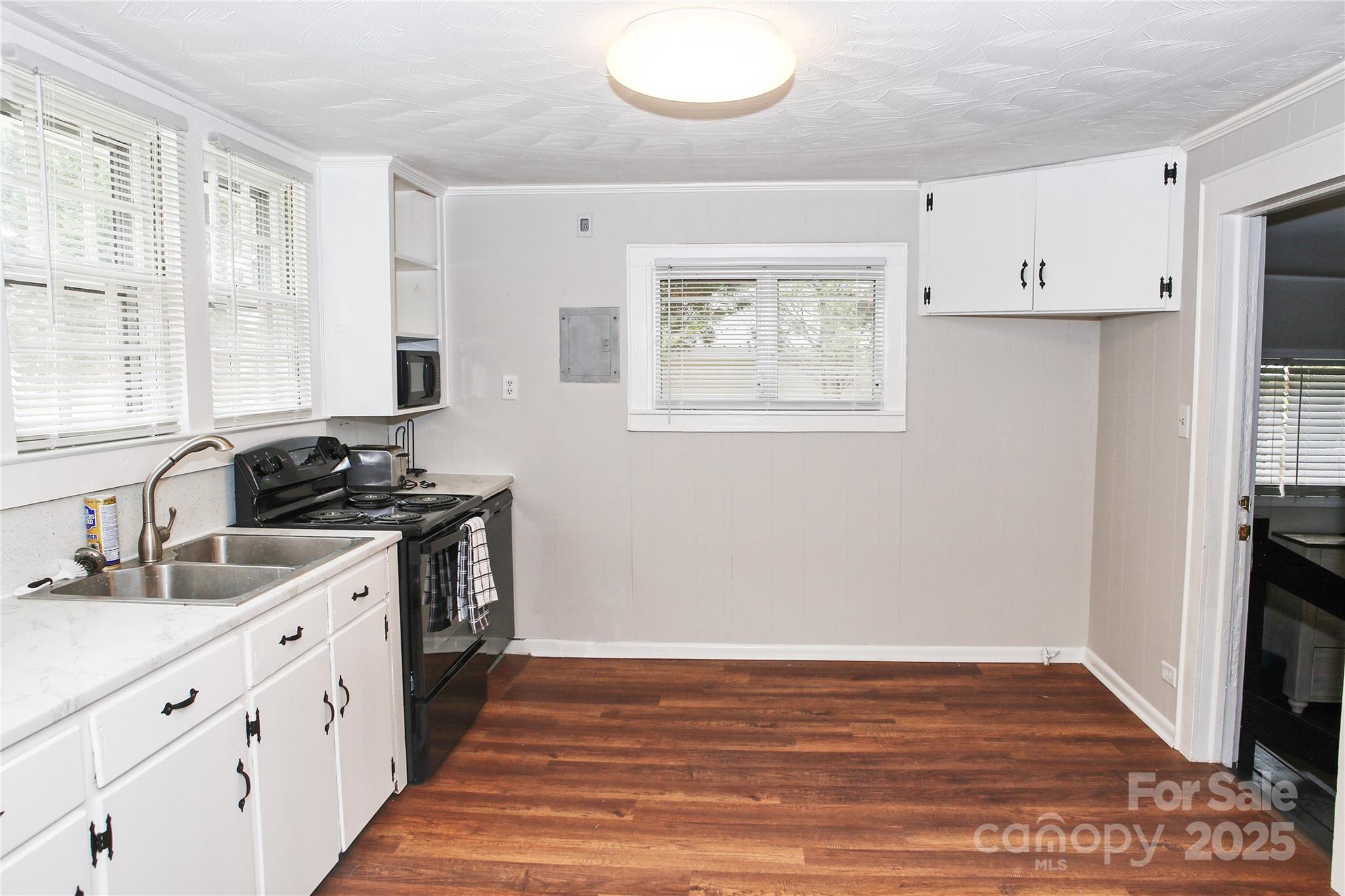218 Blacksnake Road Stanley, NC 28164 - Photo 18 of 36 a kitchen with stainless steel appliances a stove a sink and a refrigerator