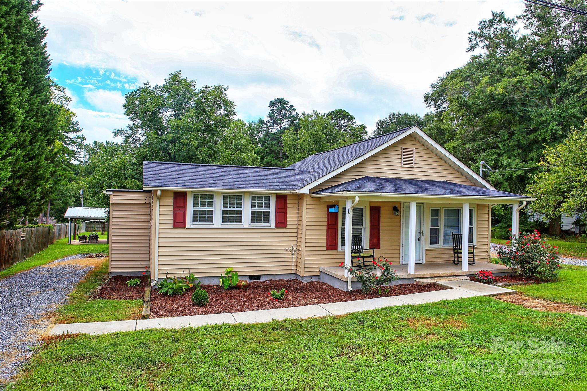 218 Blacksnake Road Stanley, NC 28164 - Photo 2 of 36 a front view of a house with a yard and porch