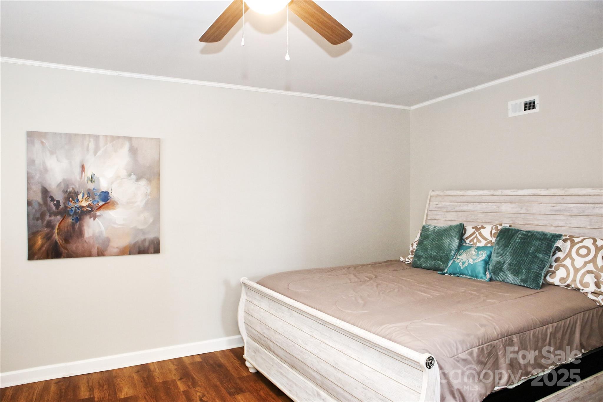 218 Blacksnake Road Stanley, NC 28164 - Photo 21 of 36 a bedroom with a bed and a painting on the wall