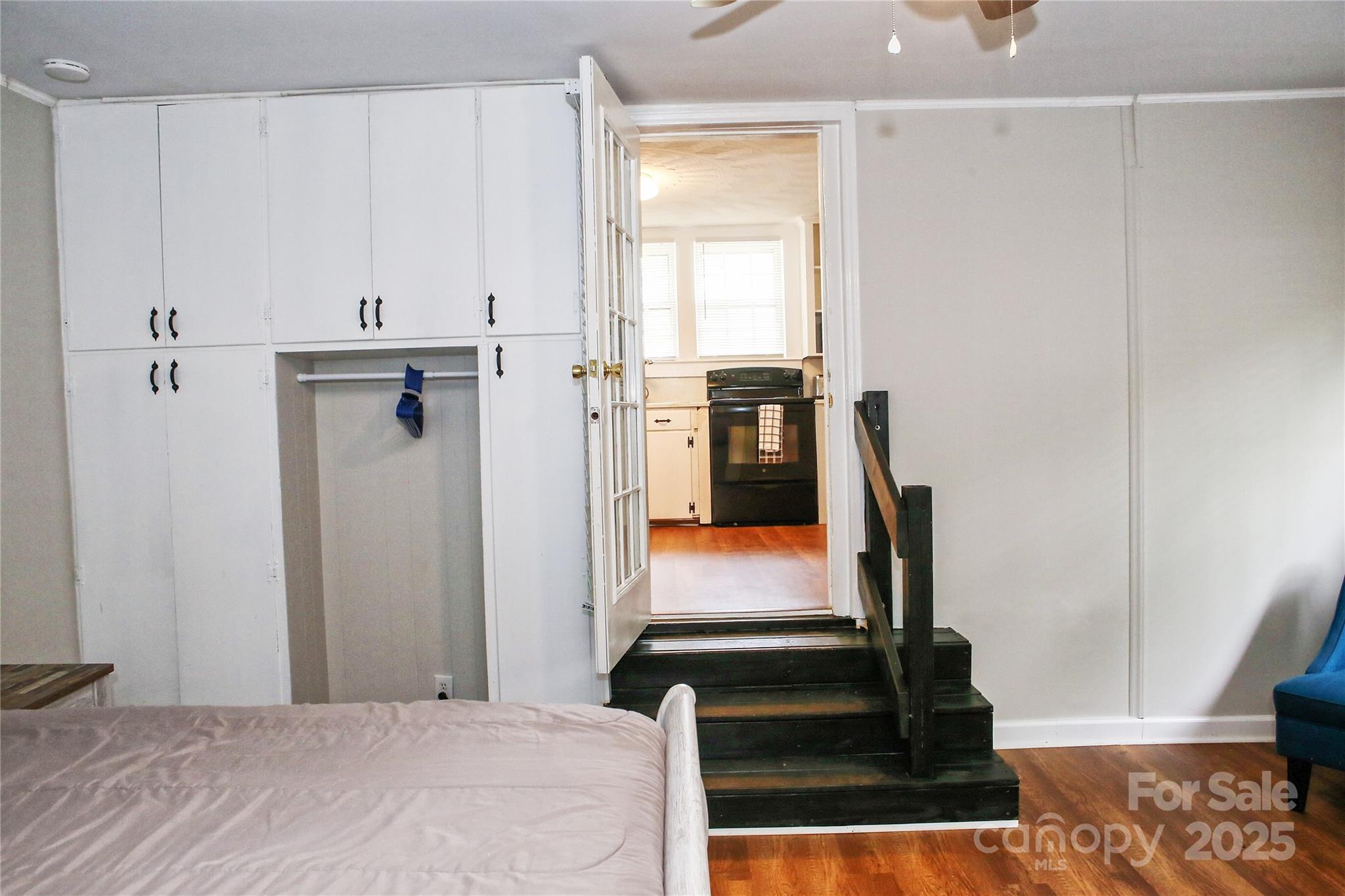 218 Blacksnake Road Stanley, NC 28164 - Photo 22 of 36 a bedroom with a bed and wooden floor