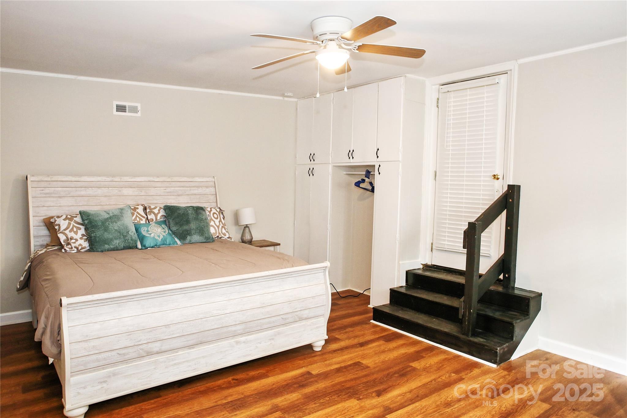 218 Blacksnake Road Stanley, NC 28164 - Photo 23 of 36 a bedroom with a bed and wooden floor