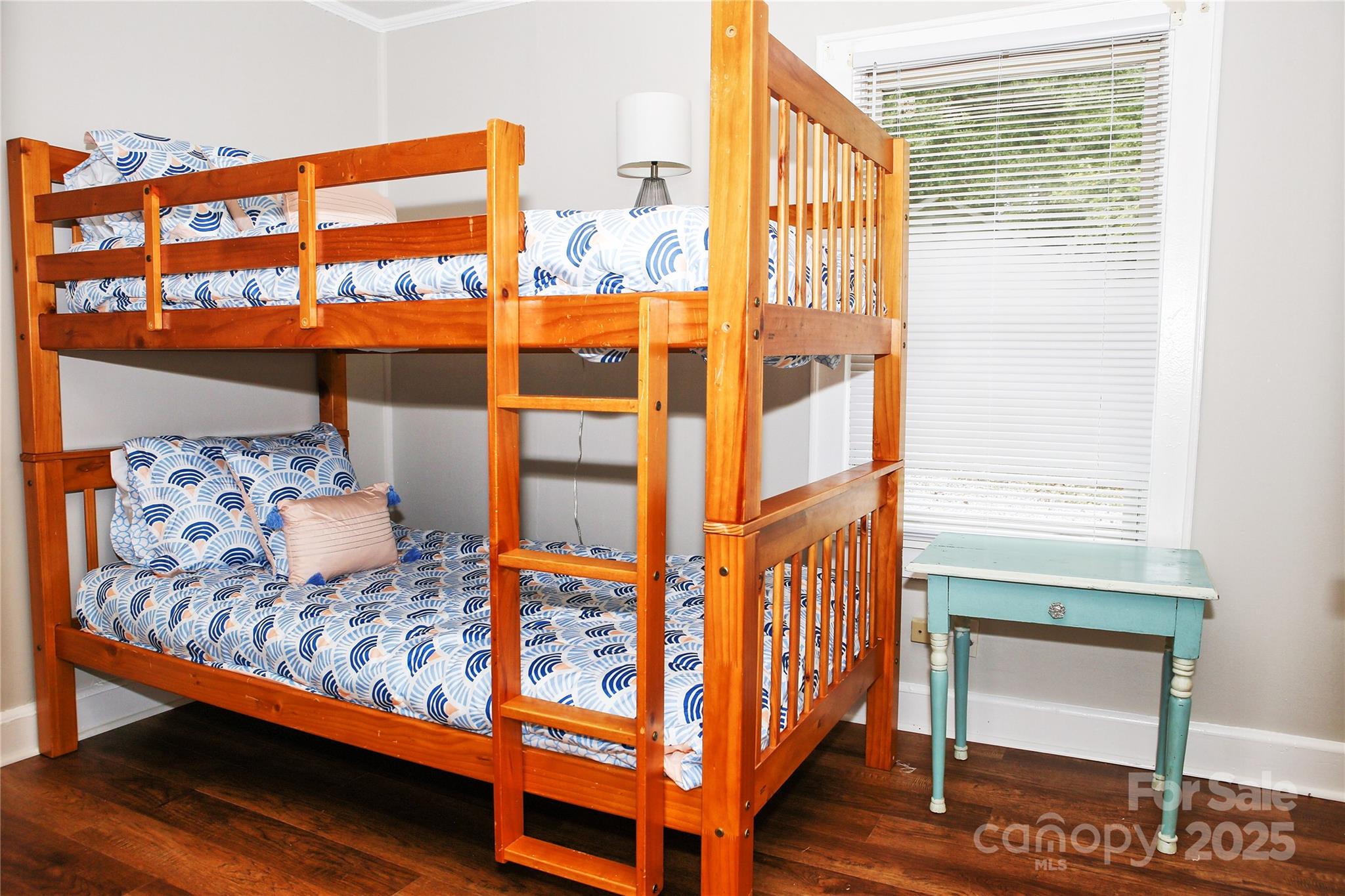 218 Blacksnake Road Stanley, NC 28164 - Photo 25 of 36 a bedroom with a bed and wooden floor