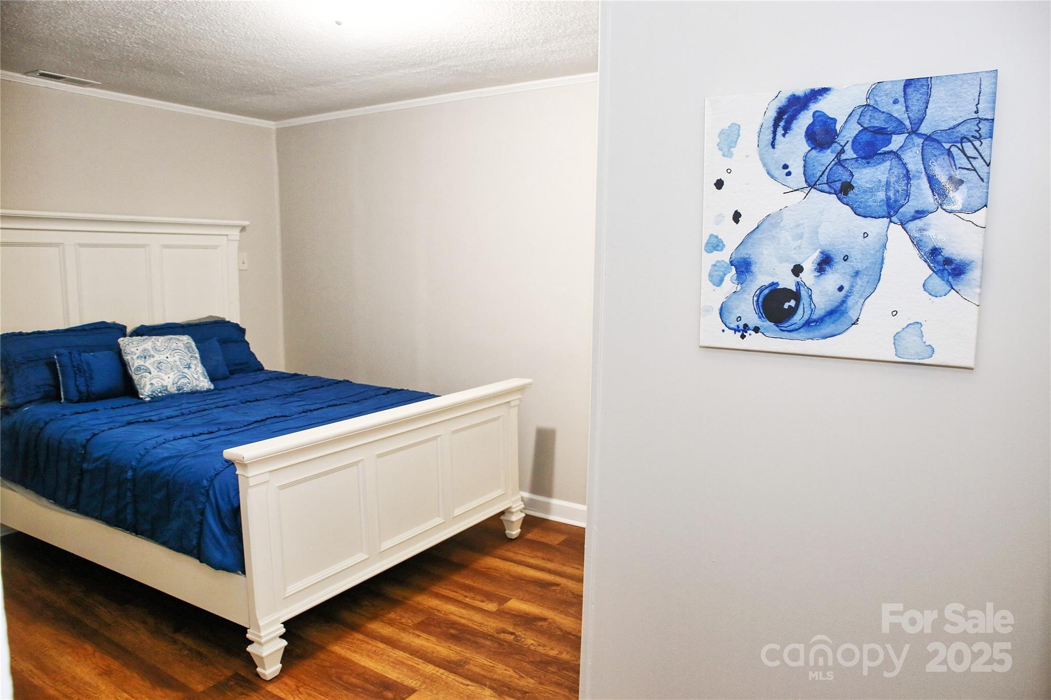218 Blacksnake Road Stanley, NC 28164 - Photo 26 of 36 a bedroom with a bed and painting on the wall