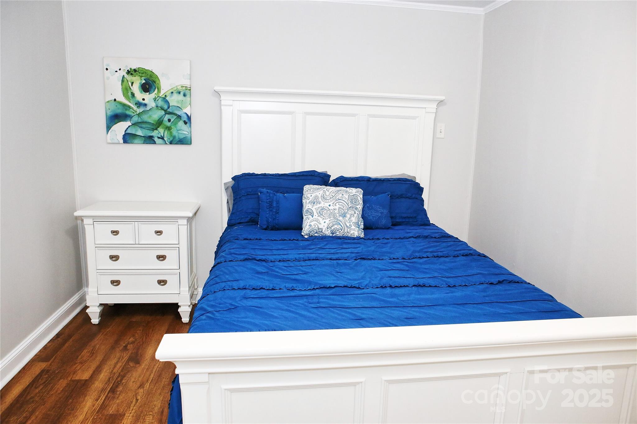 218 Blacksnake Road Stanley, NC 28164 - Photo 27 of 36 a room with chair and a wooden floor