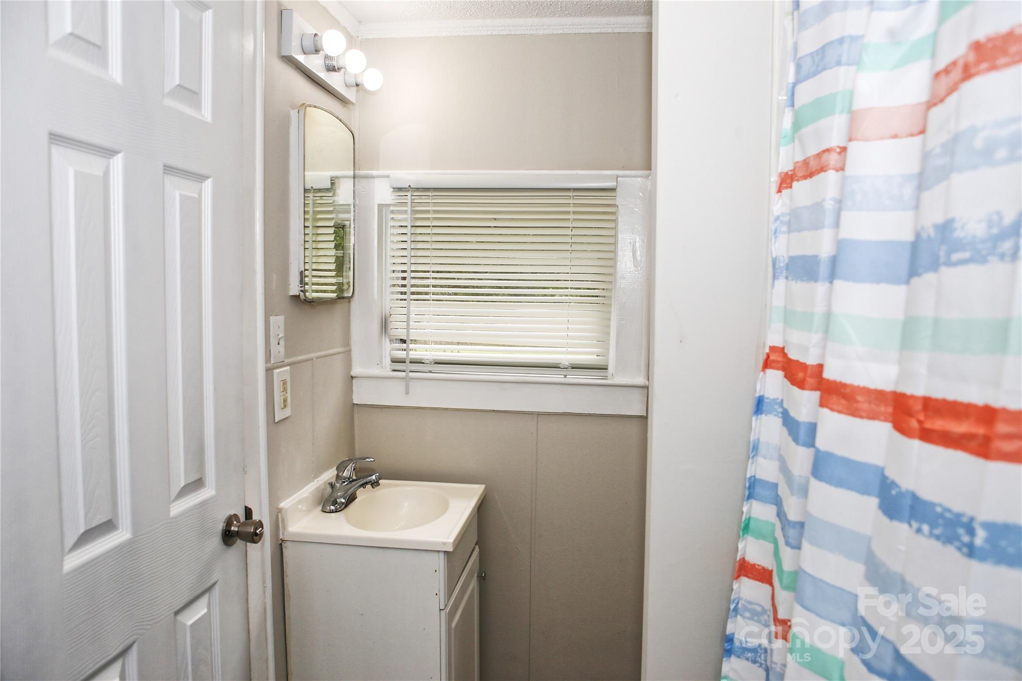 218 Blacksnake Road Stanley, NC 28164 - Photo 30 of 36 a bathroom with a sink toilet and shower