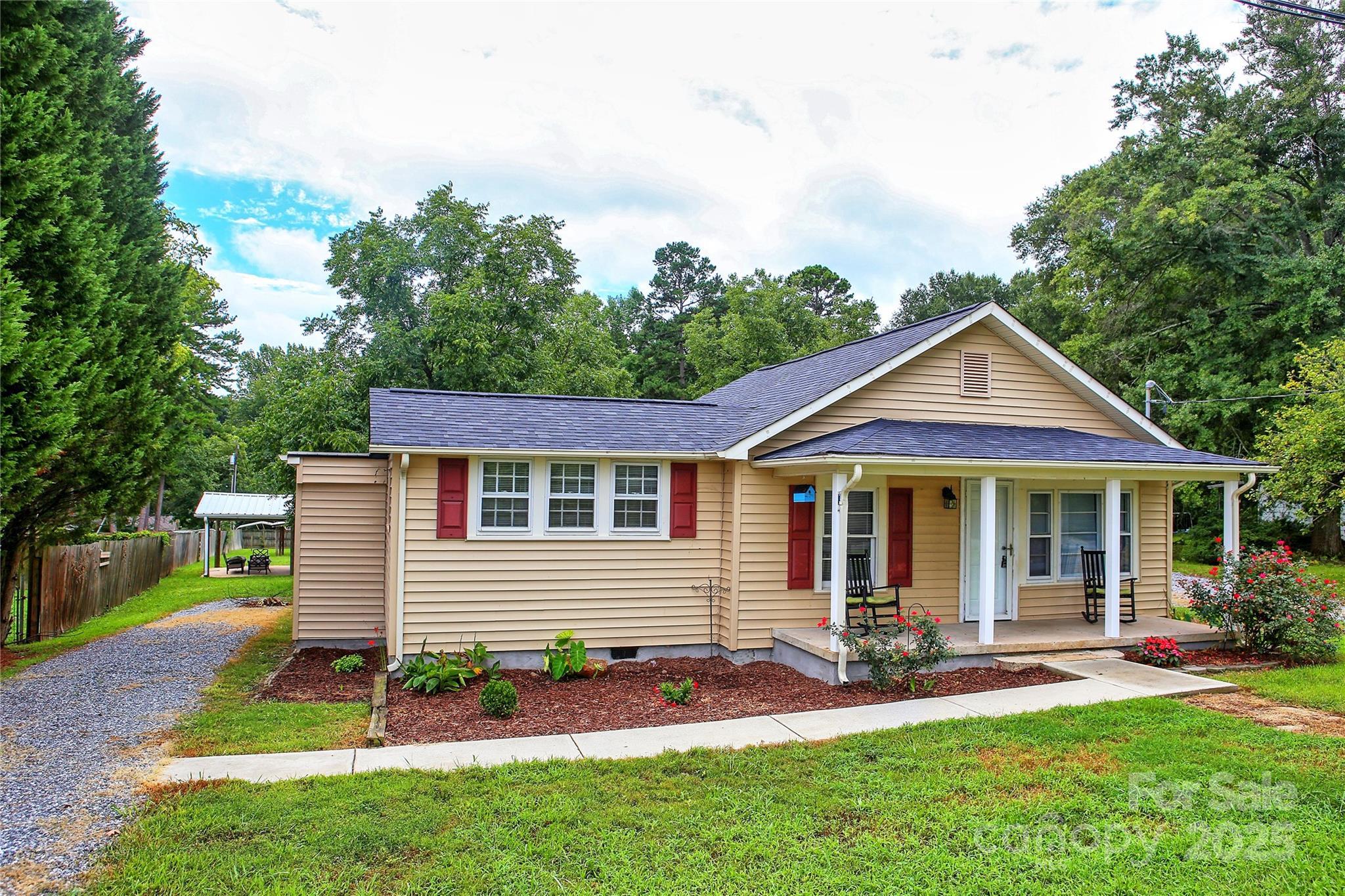 218 Blacksnake Road Stanley, NC 28164 - Photo 3 of 36 a front view of a house with a yard and green space