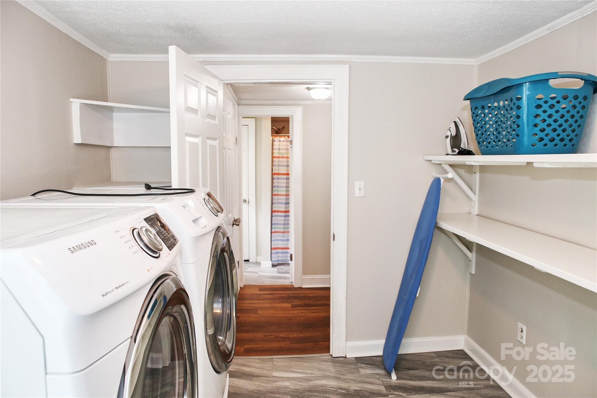 218 Blacksnake Road Stanley, NC 28164 - Photo 31 of 36 a view of a storage and utility room with washer and dryer