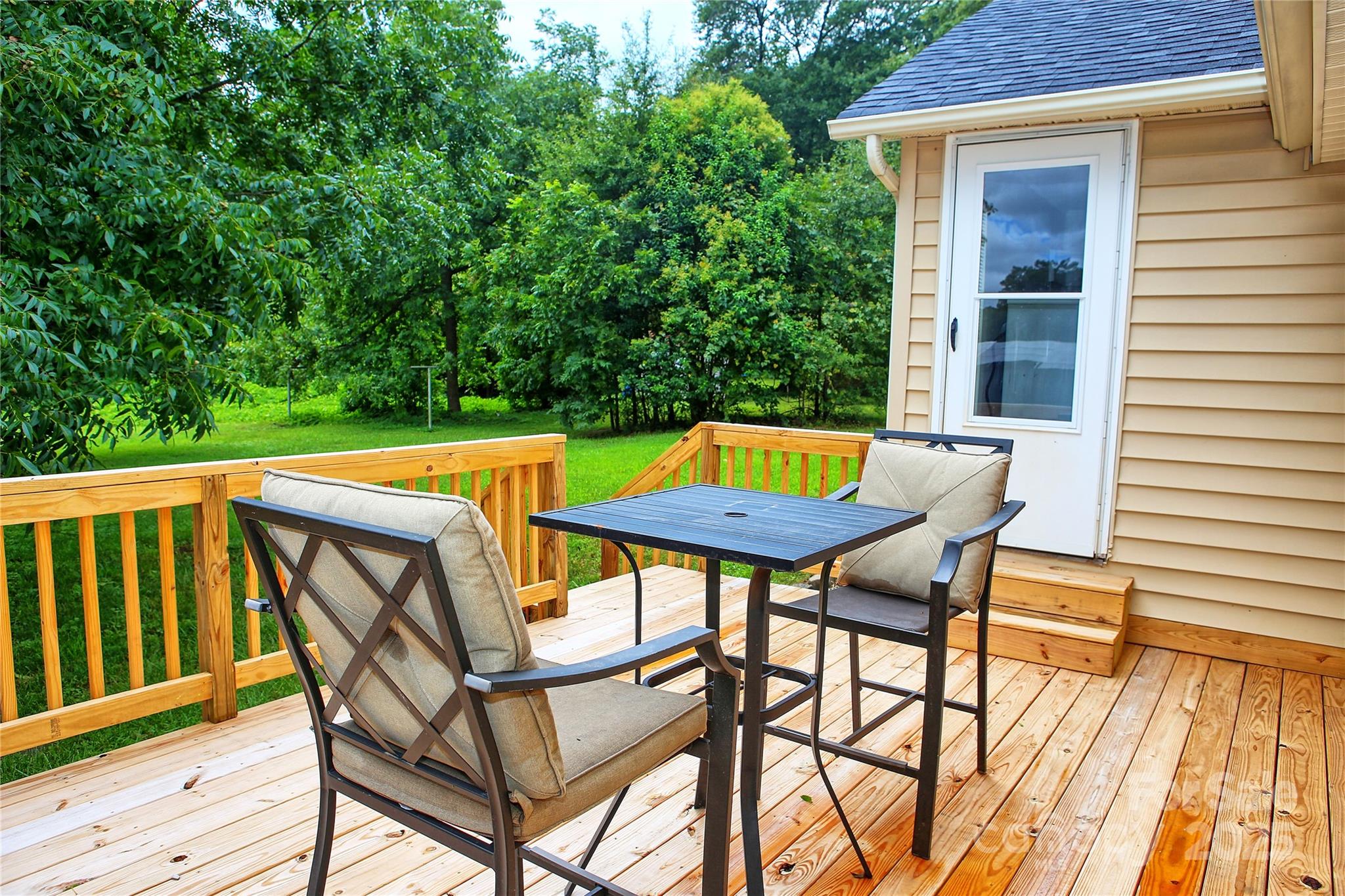 218 Blacksnake Road Stanley, NC 28164 - Photo 33 of 36 a view of a chairs and table in the patio