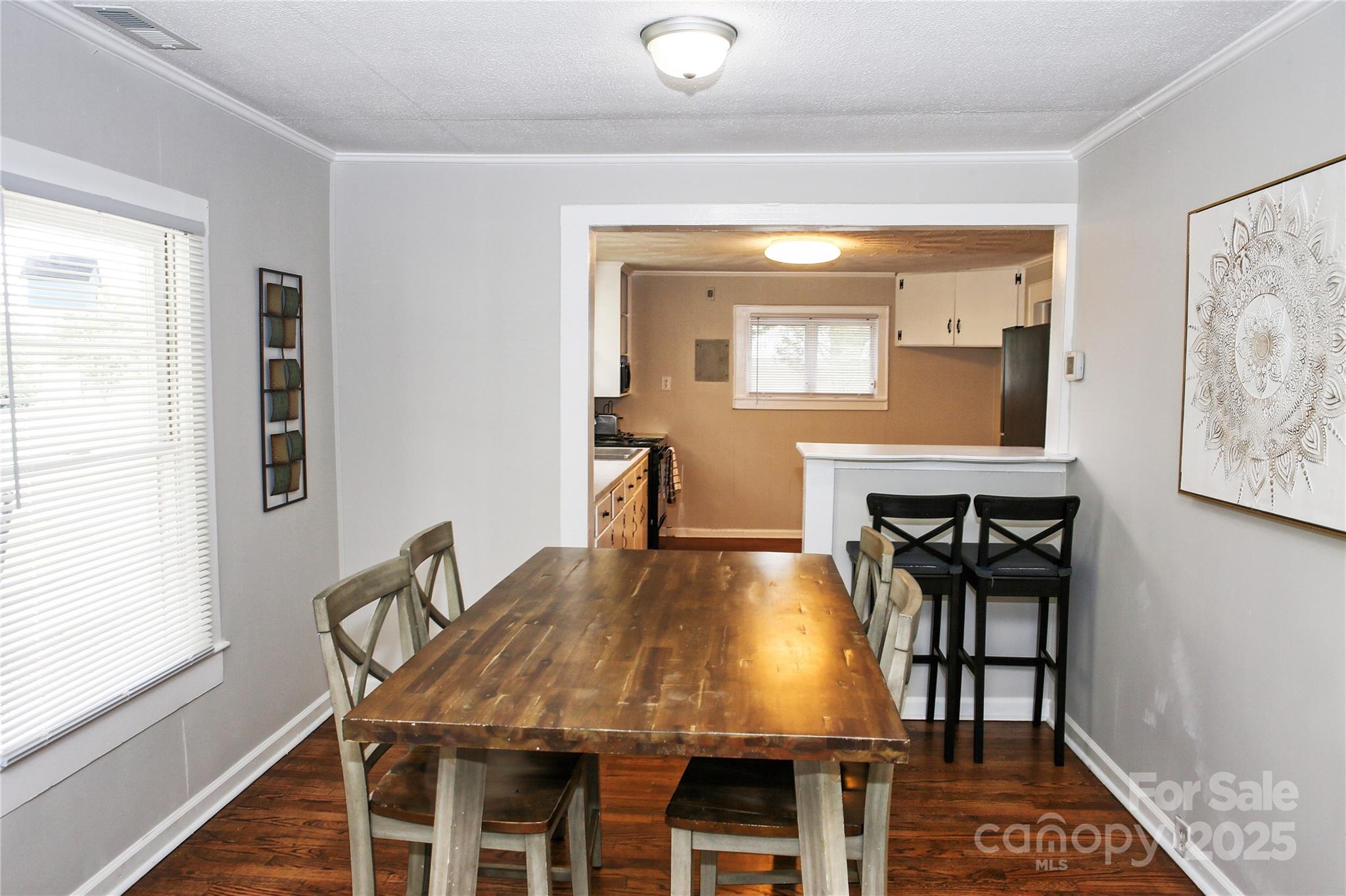 218 Blacksnake Road Stanley, NC 28164 - Photo 10 of 36 a view of a dining room with furniture and wooden floor