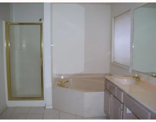 a bathroom with a bathtub and a sink