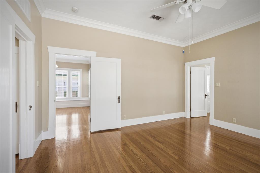 1231 West Main Street Denison, TX 75020 - Photo 21 of 31 a view of an empty room with wooden floor