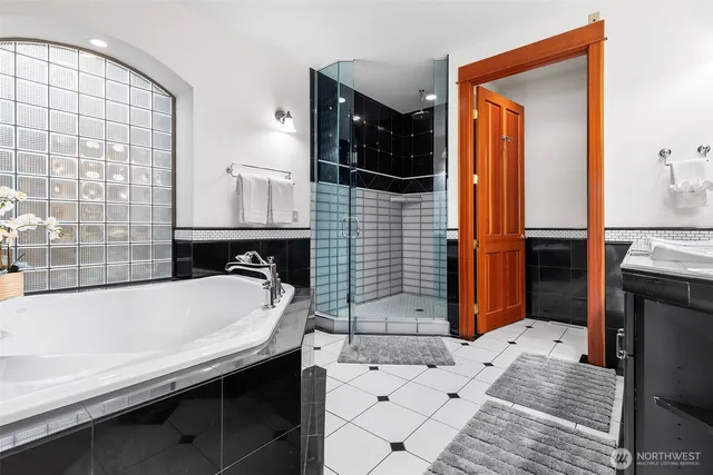 a bathroom with a bathtub and a sink