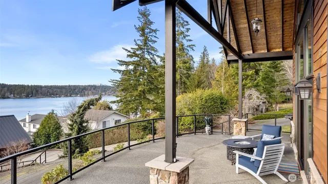 a view of a chairs and table in the balcony