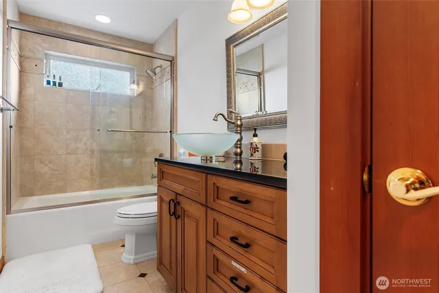a bathroom with a toilet a sink and shower