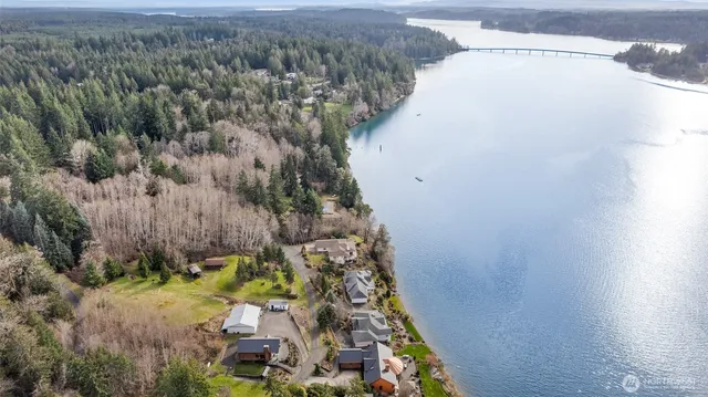 a view of a yard with wooden fence