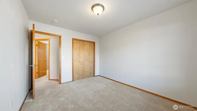 a view of an empty room and a window