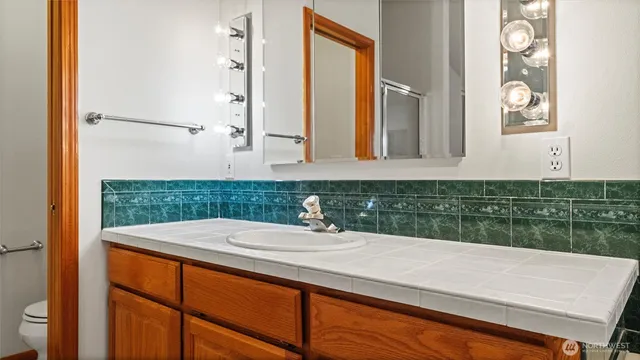 a bathroom with a bathtub and a sink