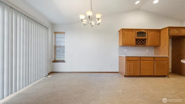 a view of a kitchen with a sink and dishwasher