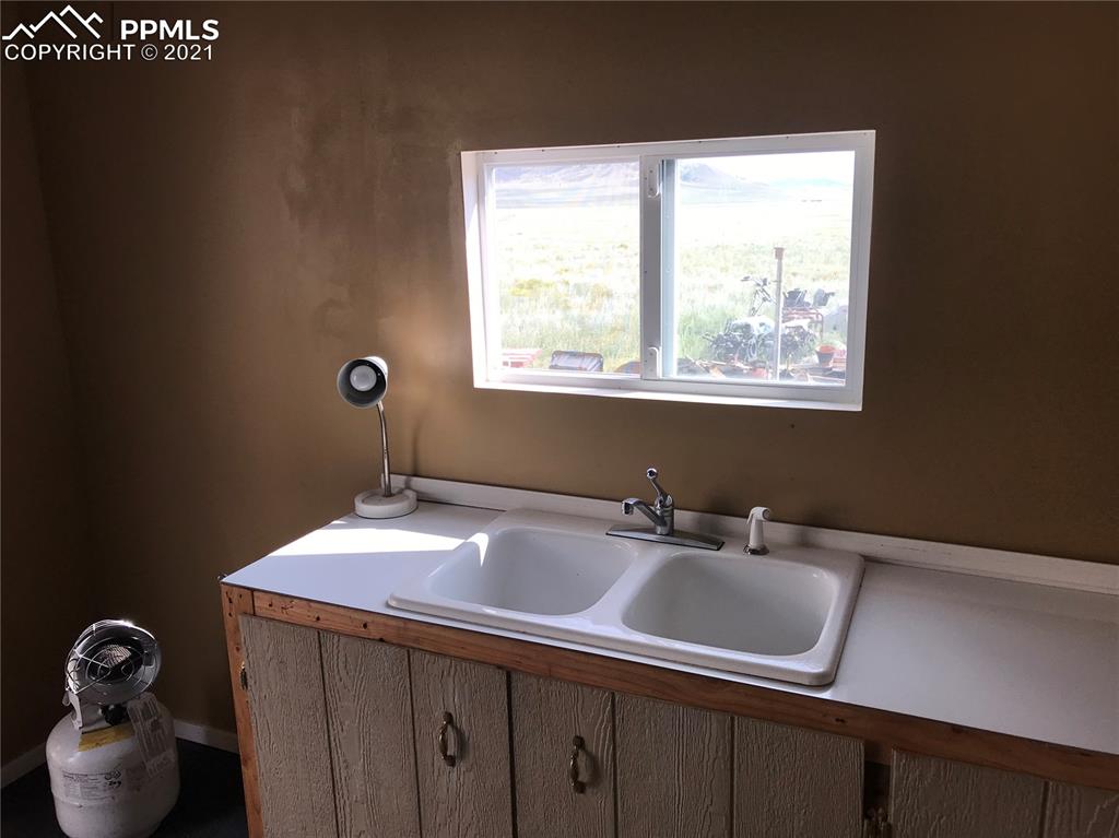 1083 Chase Gulch Road Hartsel, CO 80449 - Photo 5 of 14 a bathroom with a sink and a window