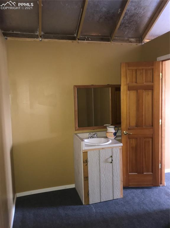 1083 Chase Gulch Road Hartsel, CO 80449 - Photo 7 of 14 a view of cabinets with wooden floor