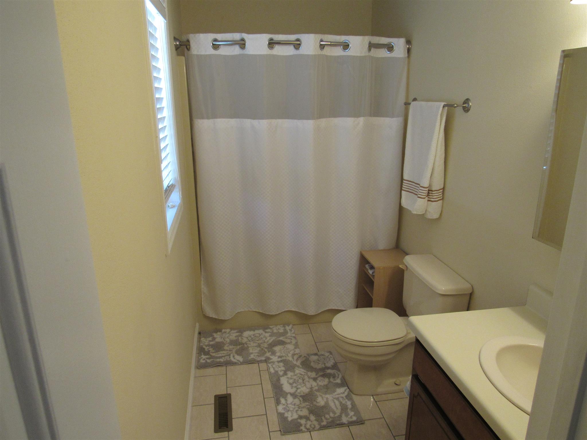 1070 Riley Creek Road Tullahoma, TN 37388 - Photo 15 of 17 a bathroom with a granite countertop sink toilet and shower