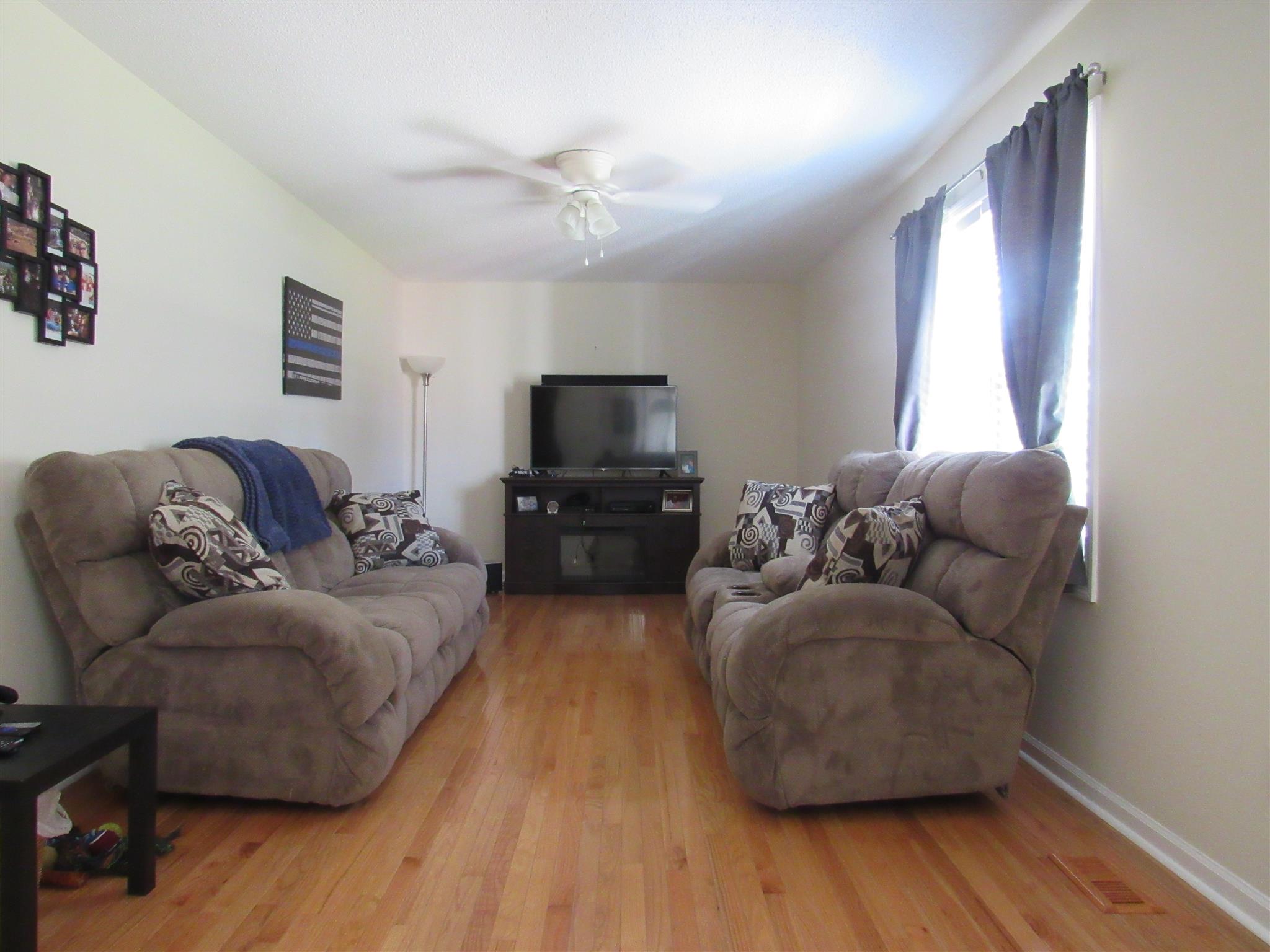 1070 Riley Creek Road Tullahoma, TN 37388 - Photo 3 of 17 a living room with furniture and a flat screen tv