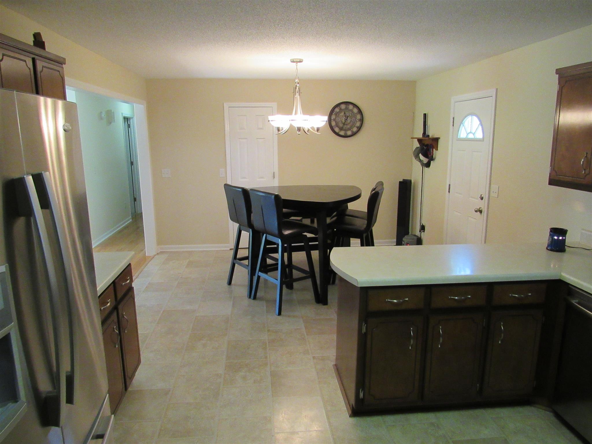 1070 Riley Creek Road Tullahoma, TN 37388 - Photo 9 of 17 a kitchen with a refrigerator a sink and a refrigerator
