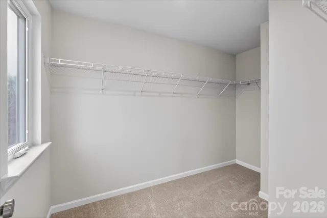 a bathroom with double sink shower and mirror