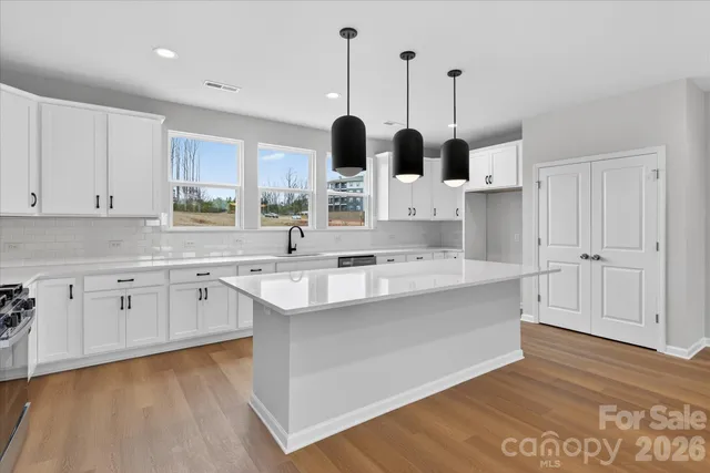 a large kitchen with cabinets