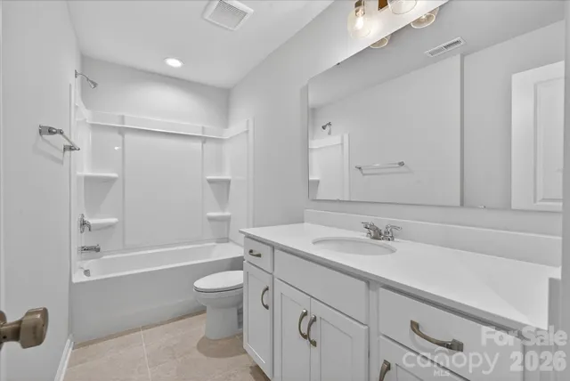 a view of a hallway with wooden floor and entryway