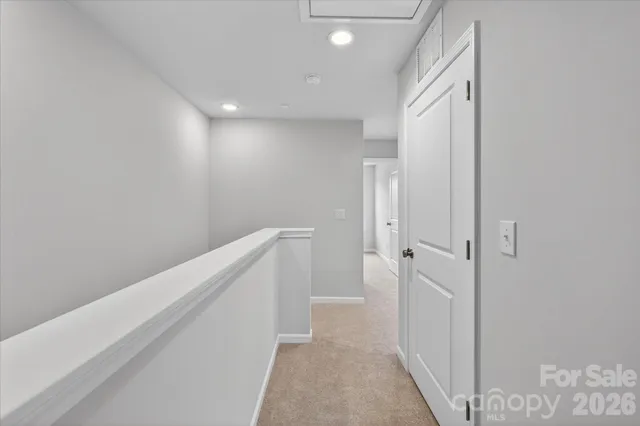 a front view of a residential apartment building with a yard