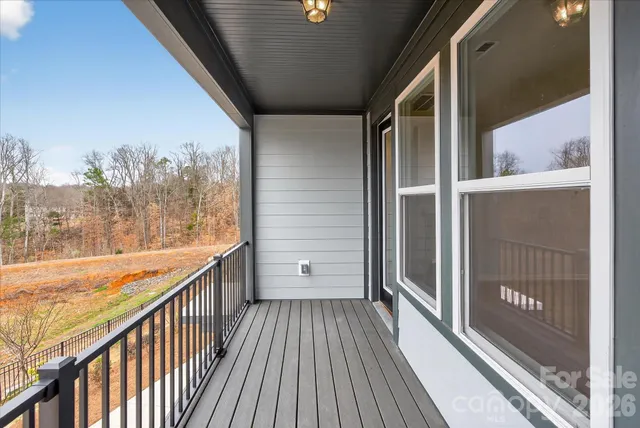 a front view of a residential apartment building with a yard