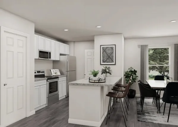 a kitchen with stainless steel appliances kitchen island granite countertop a stove a refrigerator a sink a dining table and chairs with wooden floor