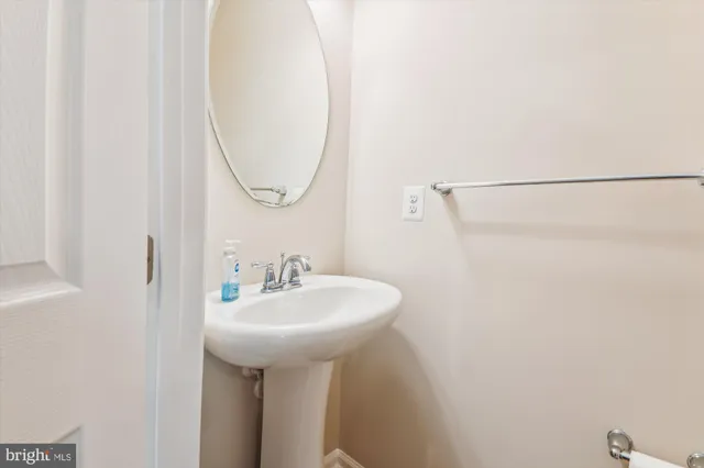 a bathroom with a sink a mirror and a shower