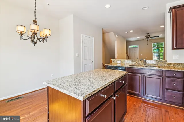 a kitchen with a sink a counter space and appliances