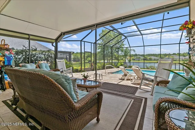 a patio with yard and outdoor seating
