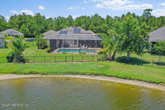 a view of a swimming pool in he middle of the green field